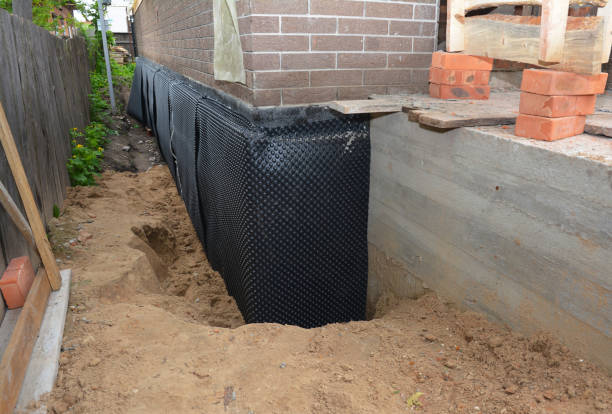 Happy homeowners after waterproofing job in Spencerville